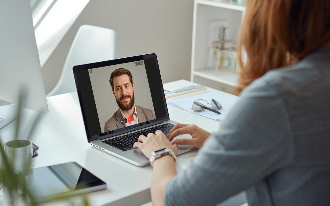 A realistic home office setup with a person attending a video call on a laptop, Video Conferencing Solutions Pakistan